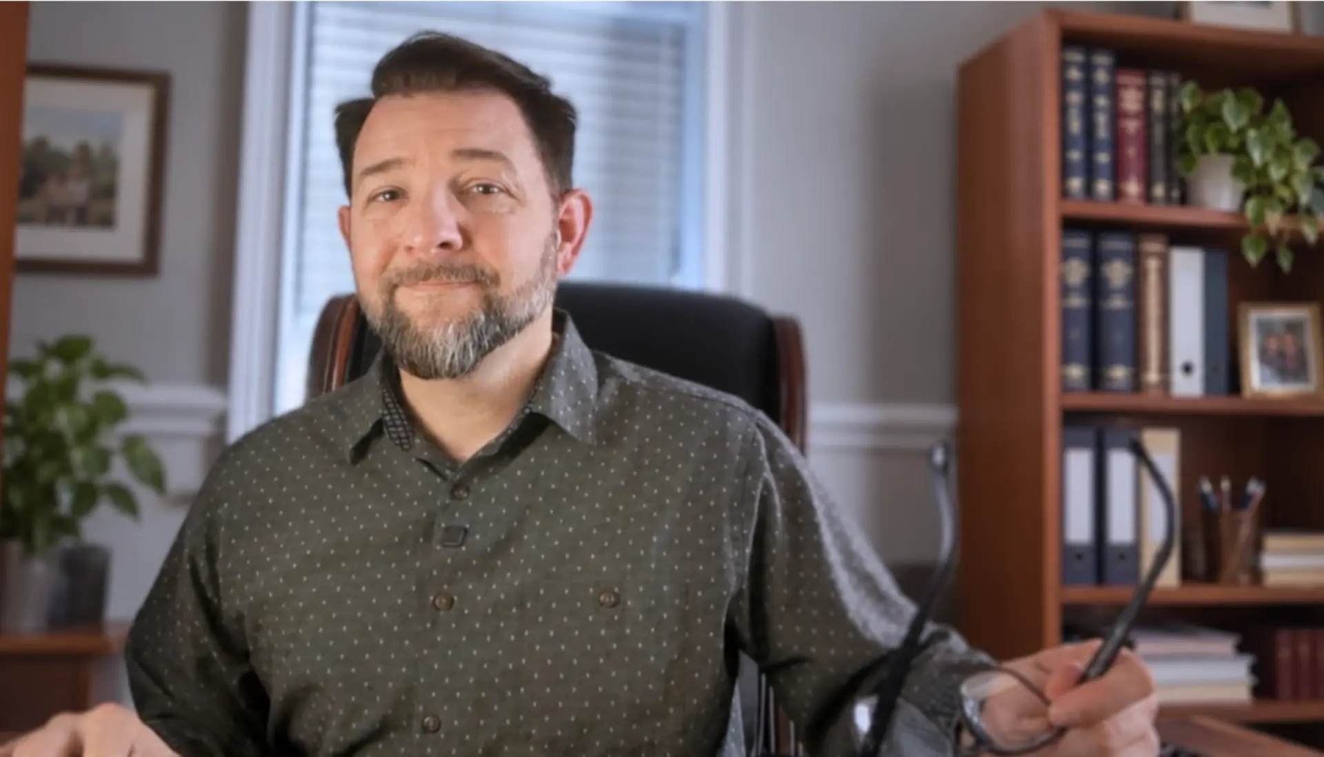 Adam Whalan, EDPNA, founder of Attain Disability Advocates, at his desk in the firm's office